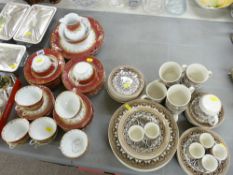 Late Victorian gilt and crimson teaset and a floral pottery breakfast set