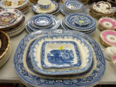 Large parcel of blue Willow ware including three meat platters and circular plates in various sizes