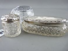 Two silver topped glass dressing table pots and one other