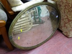 Brass framed oval bevelled edge wall mirror