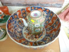 Large Imari circular bowl (damaged) and a Famille Rose lidded teapot