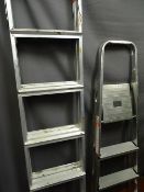 Two metal folding stepladders