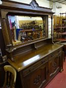 Polished wood mirror backed sideboard with carved base cupboard doors