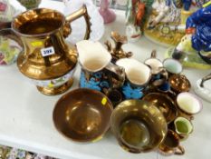 Very large copper lustre jug with mask spout and other copper lustre items