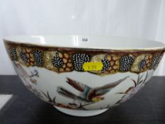 Large Oriental porcelain pedestal bowl with bird and floral decoration and beadwork band to the top