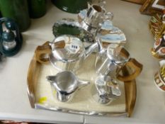 Excellent little used four piece Picquot ware tea and coffee service on a matching tray with a non-