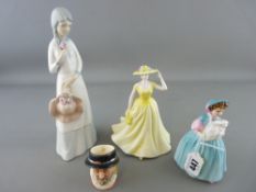 Three ornamental figurines, a small Beefeater character jug and to include a Royal Doulton 'Bunny'