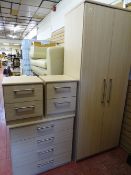 Modern light wood four piece bedroom set of two door wardrobe, four drawer chest and twin two drawer