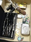 Hallmarked silver vesta case, lapel badges, vintage geometry set