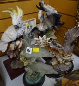 Four resin animal figures