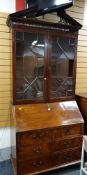 An antique bureau bookcase with astragal glazed top & good fitted interior (minor damage)