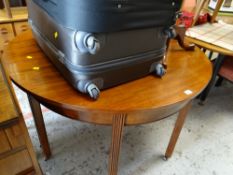 An antique circular mahogany dining table / a pair of D-end tables