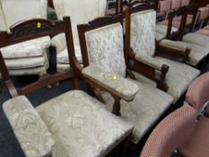 A comprehensive Edwardian drawing room suite with carved rails & floral cushioned fabric