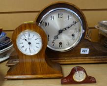 A Napoleon-style oak mantel clock together with two smaller modern clocks