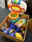 Box of mixed items including fitness weights, child's games etc