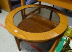 A circular mid-century two-tier & glass coffee table