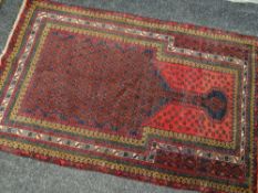A red, blue & gold ground Old Baluchi prayer rug, 143 x 91cms