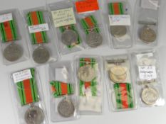 A parcel of eleven George VI defence medals inscribed with recipient details