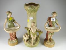 A pair of Royal Dux water carrier figures together with a Royal Dux vase