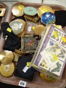 A tray of various compacts including an enamelled Royal Artillery logo, parcel of cigarette cards