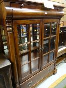 A reproduction continental-style china cabinet