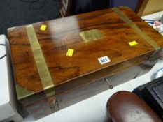 A vintage brass bound writing slope together with a small parcel of decorative plates