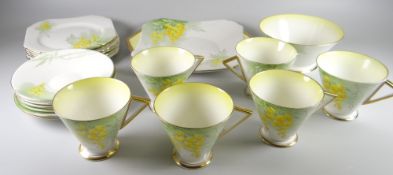 A Shelley part-teaset decorated with laburnum flowers
