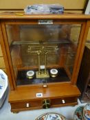 A vintage cased Oertling England laboratory scales