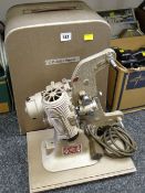 A vintage cased G B-Bell & Howell reel-to-reel projector