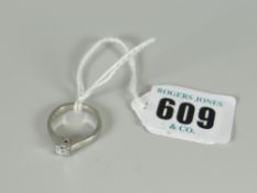 A platinum & diamond solitaire ring, 5 grams approx.