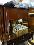 A Stag Minstrel two-door wardrobe & matching dressing table with tri-fold mirror