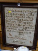 A vintage framed sampler with a biblical passage