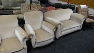 A vintage three-piece suite having been re upholstered, each item on bun feet together with a dark