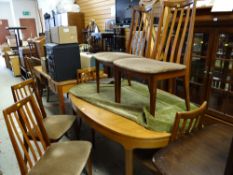 An oval G-Plan lightwood dining table & six matching chairs