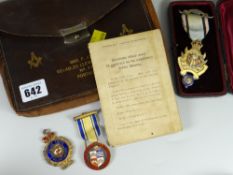 A vintage Masonic leather case containing two silver gilt Masonic jewels together with silver gilt
