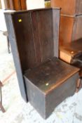 An unusual antique box seat settle