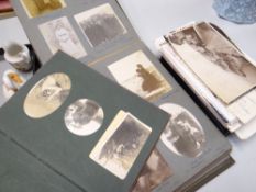 Several albums of early twentieth century photographs together with a collection of postcards