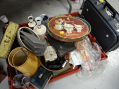 Crate of mixed items including table lamps, vintage tins, small suitcase etc