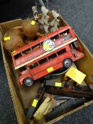 A model route master London bus together with a vintage conductor's lapel badge, metal door stops