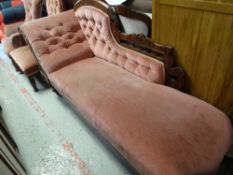 An antique chaise longue, similarly upholstered armchair & button back chair (all distressed)