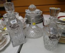 Three cut glass decanters