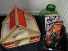 A small child's doll's house together with green glass terrarium & several magazines etc