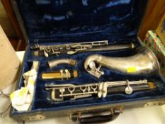 A vintage cased Cohler saxophone