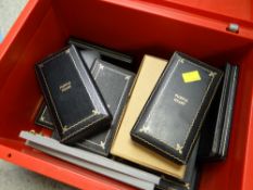 A collection of various mainly Purple Heart medal cases