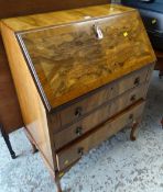 A burr effect three-drawer sloped vintage bureau