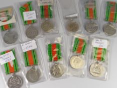A parcel of eleven George VI defence medals inscribed with recipient details