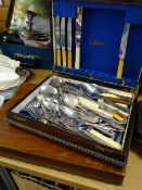 Two wooden cutlery boxes with contents