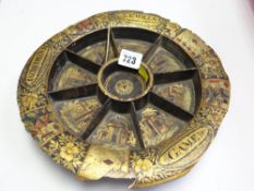An eighteenth century papier-mache revolving card-game board of circular form decorated &