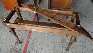 A dark stained wooden planter together with a similar dark stained coat rack