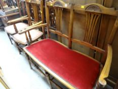 An antique carved comb back parlour suite